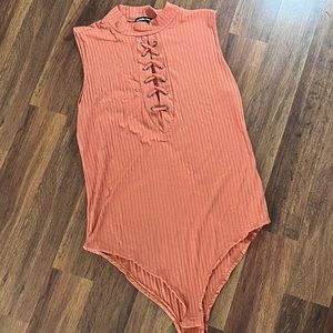 NEVER BEEN WORN high neck sleeveless body suit with lace up detailing